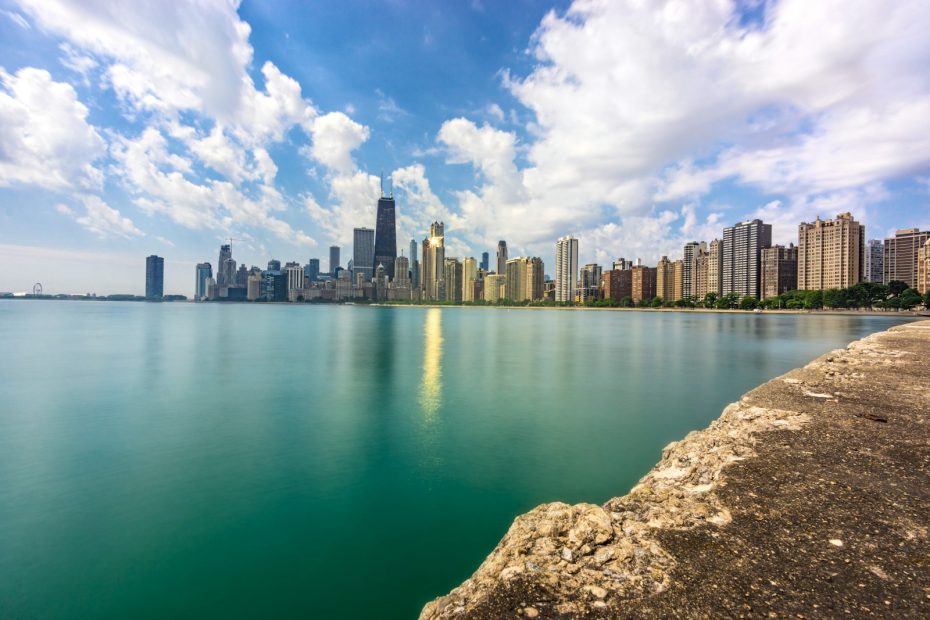 body of water near city buildings during daytime, Waukegan
