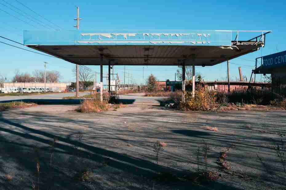 an empty gas station with a blue roof, historical gary indiana