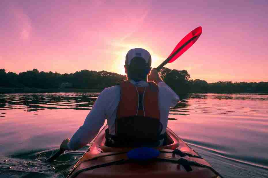 man riding on kayak, glen arbor, michigan